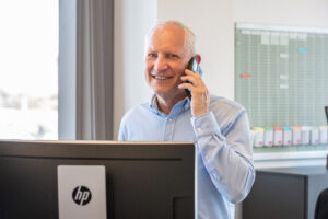 Freddy Munk Larsen, Managing Director at ProAssign ApS, talking in phone.