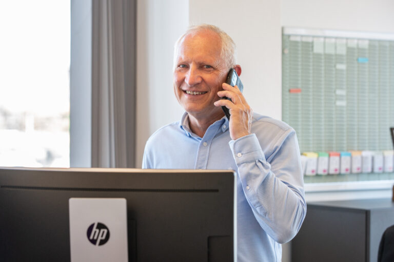 Freddy Munk Larsen, Managing Director at ProAssign ApS, talking in phone.